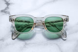 Clear acetate frame with green lenses
